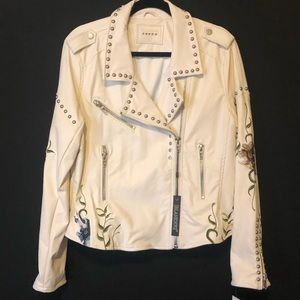 Embroidered vegan leather jacket.